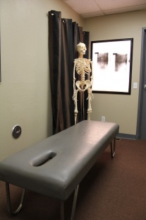 adjustment table with skeleton nearby
